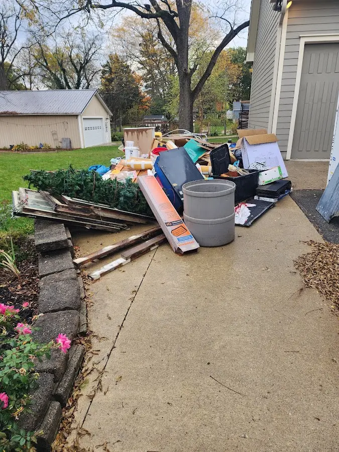 Dumpster being loaded with debris for Commercial Dumpster Rental in Dover